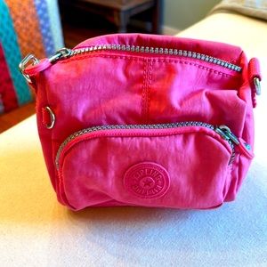 Hot pink Kipling makeup bag